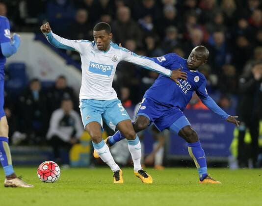 Georginio Wijnaldum of Newcastle competes with N Golo Kante of Leicester City during the Barclays Premier League match at The King Power Stadium. Photo credit should read: Malcolm Couzens Sportimage EDITORIAL USE ONLY. No use with unauthorised audio, video, data, fixture lists, club league logos or live services. Online in-match use limited to 120 images, no video emulation. No use in betting, games or single club league player publications.