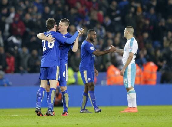 Christian Fuchs and Robert Huth of Leicester City celebrate following the Barclays Premier League match at The King Power Stadium. Photo credit should read: Malcolm Couzens Sportimage EDITORIAL USE ONLY. No use with unauthorised audio, video, data, fixture lists, club league logos or live services. Online in-match use limited to 120 images, no video emulation. No use in betting, games or single club league player publications.