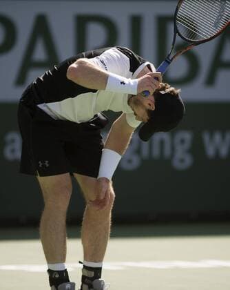 Andy Murray of Britain reacts during his third round men s singles against Federico Delbonis of Argentina at the BNP Paribas Open in Indian Wells, the United States, on March 14, 2016. Murray lost 1-2. Yang Lei) (SP)U.S.-INDIAN WELLS-TENNIS-BNP PARIBAS OPEN YangxLeixC 