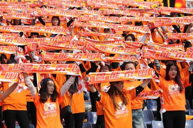 JINAN, CHINA - MARCH 16: (CHINA OUT) Shandong Luneng fans cheer during the AFC Champions League Group F match between Shandong Luneng and FC Seoul at Jinan Olympic Sports Centre on March 16, 2016 in Jinan, China.  CFP481222138 