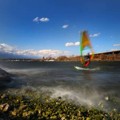March 16, 2016 - Hamilton, ON, CAN - Kristian Wolf, 29, of Burlington, takes advantage of the warmer weather and high afternoon winds to kite board on Hamilton Harbour in Hamilton, Ontario on March 16, 2016. Kite Boarding Hamilton Harbour - ZUMAp131
