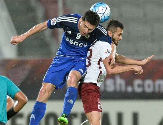 (160317) -- DOHA, March 16, 2016 -- Khalid Al Zrigi (R) of Qatar s El Jaish fights with Shomurodov Ilkom of Uzbekistan s Nasaf FC during the AFC Asian Champions League group D football match at Lekhwiya stadium in Doha, capital of Qatar, March 16, 2016. Qatar s El Jaish won 1-0. ) (SP)QATAR-DOHA-AFC ASIAN CHAMPIONS LEAGUE-GROUP D-EL JAISH VS NASAF Nikku 