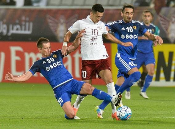 (160317) -- DOHA, March 16, 2016 -- Sardor Rashidov (C) of Qatar s El Jaish fights with Dilshod Rakhmatullaev (L) and Shukhrat Mukhammadiev of Uzbekistan s Nasaf FC during the AFC Asian Champions League group D football match at Lekhwiya stadium in Doha, capital of Qatar, March 16, 2016. Qatar s El Jaish won 1-0. ) (SP)QATAR-DOHA-AFC ASIAN CHAMPIONS LEAGUE-GROUP D-EL JAISH VS NASAF Nikku 