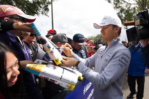 (160319) -- MELBOURNE, March 19, 2016 -- Mercedes AMG Petronas Formula One driver Nico Rosberg(R) of Germany autographs for fans before the third practice session ahead of the Australian Formula One Grand Prix in Melbourne, Australia, March 19, 2016. The Australian Formula One Grand Prix will take place in Melbourne on March 20. ) (SP)AUSTRALIA-MELBOURNE-F1-THIRD PRACTICE SESSION BaixXue 