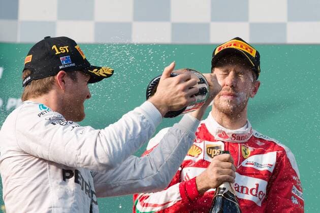 Formel 1, GP von Australien, Rosberg gewinnt Saisonauftakt in Melbourne March 20, 2016: Nico Rosberg (DEU) 6 from the Mercedes AMG Petronas team sprays Sebastian Vettel (DEU) 5 from the Scuderia Ferrari team after winning the 2016 Australian Formula One Grand Prix at Albert Park, Melbourne, Australia. Vettel came third. Formula One 2016: Australia - Race - ZUMAc04_