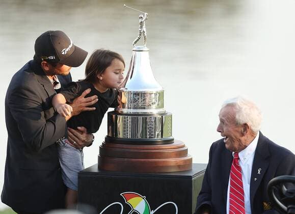 March 20, 2016 - Orlando, FL, USA - Arnold Palmer, right, smiles with delight as he watches Jason Day hoist his son Dash up to kiss the championship trophy after Day won the Arnold Palmer Invitational at Bay Hill Club & Lodge in Orlando, Fla., on Sunday, March 20, 2016. Jason Day goes wire to wire to win at Bay Hill - ZUMAm67_