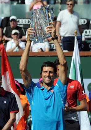 20 Mar. 2016: Novak Djokovic (SRB) holds the winners trophy over his head after Djokovic defeated Milos Raonic (CAN) 6-2, 6-0 to become the 2016 BNP Paribas Open Champion in a tournament played at the Indian Wells Tennis Garden in Indian Wells, CA. (Photo By John Cordes Icon Sportswire) TENNIS: MAR 20 BNP Paribas Open Icon506160320027 EDITORIAL USE ONLY