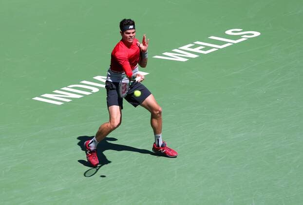 March 20, 2016: Milos Raonic of Canada returns a shot against Novak Djokovic of Serbia during the mens final of the 2016 BNP Paribas Open at Indian Wells Tennis Garden in Indian Wells, California. TENNIS 2016: BNP Paribas Open MAR 20 - ZUMAcb8_