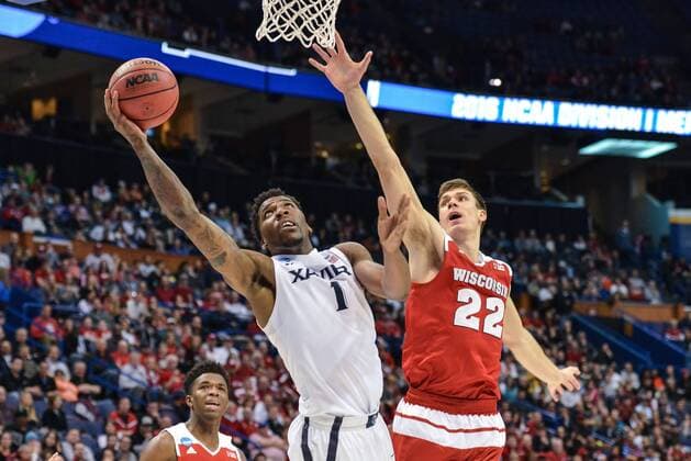 March 20, 2016 - St. Louis, Missouri, U.S - Xavier Musketeers forward JALEN REYNOLDS (1) gets inside Wisconsin Badger forward ETHAN HAPP (22) for a reverse layup shot during the second round of the Midwest Region in the 2016 NCAA College League USA Men s Basketball Tournament, where 10 Wisconsin upsets 2 Xavier by the score of 63-60 to advance to the sweet 16., held at The Scottrade Center in St. Louis, MO NCAA Basketball 2016 - Xavier vs Wisconsin - ZUMAu300