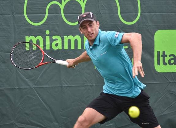 Austalian tennis player John Millman returns the ball to Spanish Pablo Carreno Busta during the first journey of the Masculine Miami Tennis Open in Cayo Vizcaino, Miami, FL, United States, 24 March 2016. PABLO CARRENO BUSTA VS JOHN MILLMAN !ACHTUNG: NUR REDAKTIONELLE NUTZUNG!  MIA010 20160324-635944547886802149