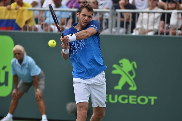 French tennis player Paul-Henri Mathieu returns the ball to Colombian Santiago Giraldo during the first journey of the Masculine Miami Tennis Open in Cayo Vizcaino, Miami, FL, United States, 24 March 2016. PAUL-HENRI MATHIEU VS SANTIAGO GIRALDO !ACHTUNG: NUR REDAKTIONELLE NUTZUNG!  MIA023 20160325-635944656580542664