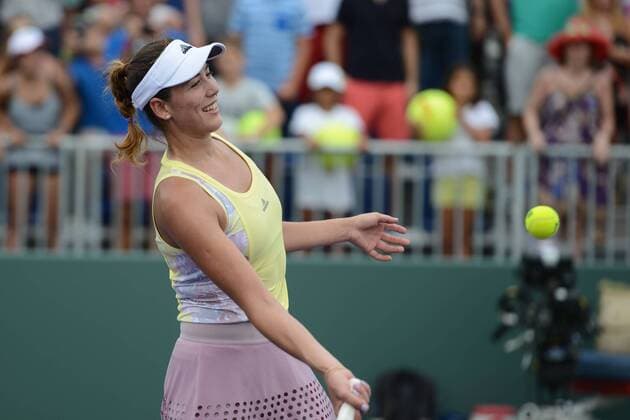 March 25, 2016 - Miami, Florida, United States - GARBINE MUGURUZA of Spain hits a tennis ball into the crowd after winning her match vs. D. Cibulkova at the Miami Open. Tennis 2016 - Miami Open - Day 5 - ZUMAl132