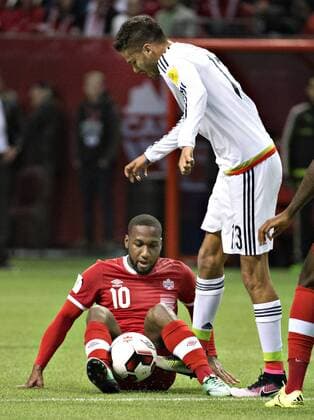 (160326) -- VANCOUVER, March 26, 2016 -- Canada s David Hoilett (L) vies with Mexico s Diego Reyes during a qualifier game of 2018 FIFA World Cup WM Weltmeisterschaft Fussball in Vancouver, Canada, March 25, 2016. Mexico won 3-0. ) (SP)CANADA-VANCOUVER-FIFA 2018 WORLD CUP-QUALIFICATION MATCH-CANADA VS MEXICO AndrewxSoong 