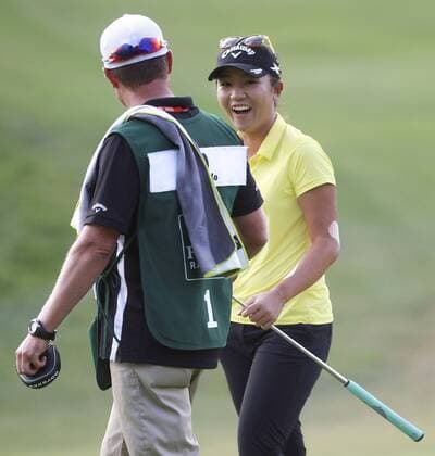 March 27, 2016 - Carlsbad, USA - CARLSBAD, March 27, 2016 Lydia Ko smiles at her caddie Jason Hamilton after making a birdie at the 16th hole during the final round of the Kia Classic at the Aviara Golf Club in Carlsbad on Sunday. -Mandatory Photo Credit: Photo by Hayne Palmour IV San Diego Union-Tribune, LLC Lydia Ko smiles at her caddie Jason Hamilton after making a birdie at the 16th hole. - ZUMAs44_