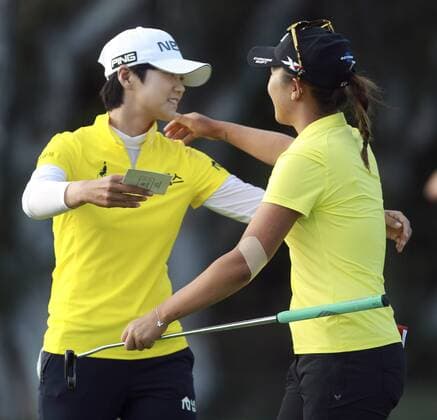 March 27, 2016 - Carlsbad, USA - CARLSBAD, March 27, 2016 Lydia Ko hugs Sung Hyun Park at the 18th hole after Ko won the Kia Classic at the Aviara Golf Club in Carlsbad on Sunday. -Mandatory Photo Credit: Photo by Hayne Palmour IV San Diego Union-Tribune, LLC Lydia Ko hugs Sung Hyun Park at the 18th hole after Ko won the Kia Classic. - ZUMAs44_