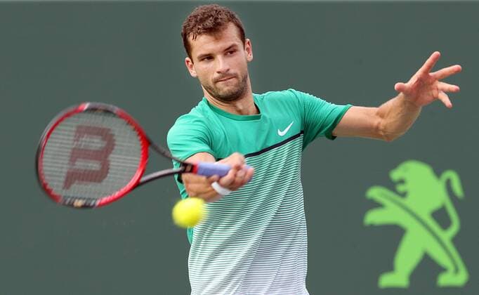 March 28, 2016 - Key Biscayne, FL, USA - Grigor Dimitrov of Bulgaria returns a shot against Andy Murray of Great Britain during a men s fourth-round match at the Miami Open on Monday, March 28, 2016, in Key Biscayne, Fla. Miami Open - ZUMAm67_