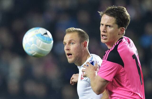 Daniel Kolar of Czech Republic, left, and Christophe Berra of Scotland in action during the friendly soccer match Czech Republic vs Scotland in Prague, Czech Republic, Thursday, March 24, 2016. (CTKxPhoto MichalxDolezal) CTKPhotoP201603241081601  dol 0013