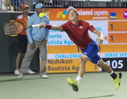 Japan s Nishikori in 4th round match at Miami Open Kei Nishikori of Japan hits a return to Roberto Bautista Agut of Spain during a fourth-round match of the Miami Open tennis tournament in Miami, Florida, on March 29, 2016. 