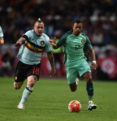 LEIRIA, March 29, 2016 -- Portugal s Nani (R) vies with Belgium s Nainggolan during a friendly soccer match betweem Portugal and Belgium in preparation for Euro 2016 in France at Leiria Municipal Stadium, Portugal, on March 29, 2016. Portugal won 2-1. ) (SP)PORTUGAL-LEIRIA-SOCCER-PORTUGAL VS BELGIUM ZhangxLiyun 