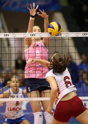 KRASNODAR, RUSSIA. APRIL 2, 2016. Dinamo s Mariia Bibina, Liubov Sokolova and Galatasaray s Charlotte Leys (L-R) in action in the rematch of the 2015 16 Season CEV Women s Volleyball Cup Finals at Olimp Sports Palace. Dinamo Krasnodar won the game 3:0. Vitaly Timkiv TASS  TS01E4DF