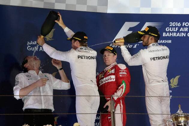 FORMULA 1 - Bahrain GP SAKHIR,BAHRAIN,03.APR.16 - MOTORSPORTS, FORMULA 1 - FIA World Championship WM Weltmeisterschaft Grand Prix of Bahrain, Bahrain International Circuit, award ceremony. Image shows executive director Toto Wolff (Mercedes GP), Nico Rosberg (GER Mercedes GP), Kimi Raikkoenen (FIN Ferrari) and Lewis Hamilton (GBR Mercedes GP). Keywords: champagne shower. GEPAxpictures xFritzxMueller