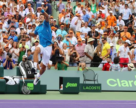 April 3, 2016 - Key Biscayne, FL, USA - Serbia s Novak Djokovic leaps into the air after defeating Japan s Kei Nishikori 6-3, 6-3, to win the Miami Open championship on Sunday, April 3, 2016, at Cradon Park Tennis Center in Key Biscayne, Fla. World No. 1 Novak Djokovic defeats Kei Nishikori for Miami Open title - ZUMAm67_