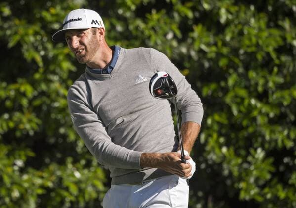 Dustin Johnson watches his shot on the 5th tee during a practice round before the 2016 Masters Tournament at Augusta National in Augusta, Georgia on April 5, 2016.  AUG20160405313 KEVINxDIETSCH