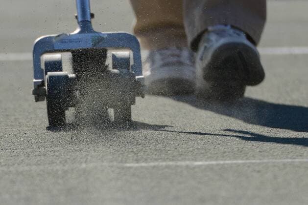 April 5, 2016 - Charleston, South Carolina, United States - A grounds person cleans the lines on a court at the Volvo Car Open Tennis 2016 - Volvo Car Open - Day 2 - ZUMAl132
