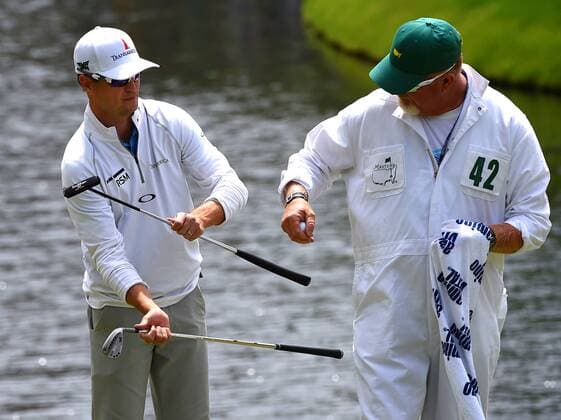 April 6, 2016 - Augusta, GA, USA - Zach Johnson, left, looks to switch clubs with his caddie, Damon Green, right, prior to putting on the 16th green during a practice round on Wednesday, April 6, 2016, at Augusta National Golf Club in Augusta, Ga. First round action of The Masters tournament begins on Thursday. Masters practice - ZUMAm67_