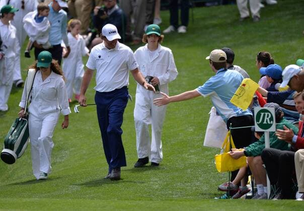 Phil Mickelson greets patrons as he walks onto the ninth green during the Par Three Contest at the 2016 Masters Tournament at Augusta National in Augusta, Georgia on April 6, 2016.  AUG20160406334 KEVINxDIETSCH