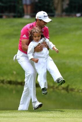 Jason Day holds his son Dash during the Par Three Contest at the 2016 Masters Tournament at Augusta National in Augusta, Georgia on April 6, 2016.  AUG20160406319 KEVINxDIETSCH