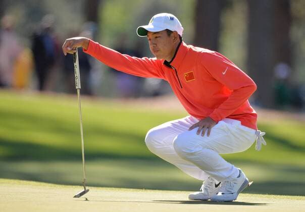 Cheng Jin from China lines up a putt on the 3rd hole in the first round of the 2016 Masters Tournament at Augusta National in Augusta, Georgia on April 7, 2016.  MAS20160407133 KEVINxDIETSCH