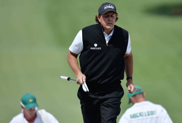 Phil Mickelson reacts as he walks to the 7th green after hitting out of a bunker in the first round of the 2016 Masters Tournament at Augusta National in Augusta, Georgia on April 7, 2016.  MAS20160407146 KEVINxDIETSCH