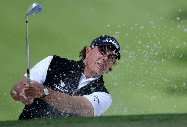 Phil Mickelson hits out of a bunker to the 7th green in the first round of the 2016 Masters Tournament at Augusta National in Augusta, Georgia on April 7, 2016.  MAS20160407153 KEVINxDIETSCH