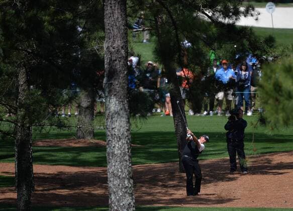 Phil Mickelson hits out of the pine straw rough on the 7th hole in the first round of the 2016 Masters Tournament at Augusta National in Augusta, Georgia on April 7, 2016.  MAS20160407158 KEVINxDIETSCH