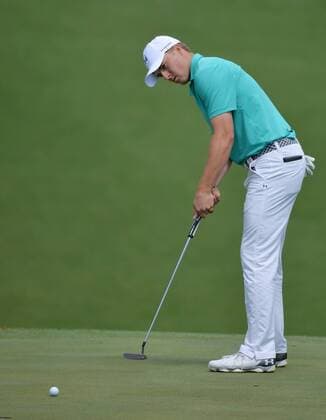 Jordan Spieth makes a putt for birdie on the 10th hole in the first round of the 2016 Masters Tournament at Augusta National in Augusta, Georgia on April 7, 2016.  MAS20160407150 KEVINxDIETSCH