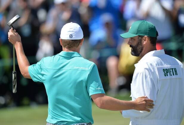 Caddie Michael Greller stands with Jordan Spieth on the 18th hole in the first round of the 2016 Masters Tournament at Augusta National in Augusta, Georgia on April 7, 2016.  MAS20160407172 KEVINxDIETSCH