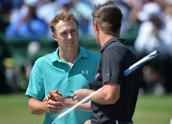 Jordan Spieth shakes hands with Bryson DeChambeau at the end of the round on the 18th hole in the first round of the 2016 Masters Tournament at Augusta National in Augusta, Georgia on April 7, 2016.  MAS20160407173 KEVINxDIETSCH