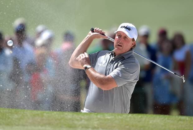 Phil Mickelson reacts after hitting a shot from a green side bunker that eventually lands back in the sand on the 7th hole in the second round of the 2016 Masters Tournament at Augusta National in Augusta, Georgia on April 8, 2016. Tom Watson announced that this 2016 Masters will be his last.  MAS20160408141 KEVINxDIETSCH