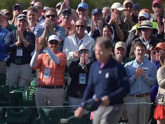 Fans react as Tom Watson takes off his cap on the 18th green in the second round of the 2016 Masters Tournament at Augusta National in Augusta, Georgia on April 8, 2016. Tom Watson missed the cut with a score of 8 over par in his last ever Masters.  MAS20160408159A KEVINxDIETSCH