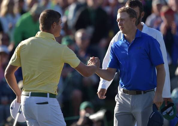 Jordan Spieth shakes hands with Bryson DeChambeau on the 18th green in the second round of the 2016 Masters Tournament at Augusta National in Augusta, Georgia on April 8, 2016.  MAS20160408173 KEVINxDIETSCH