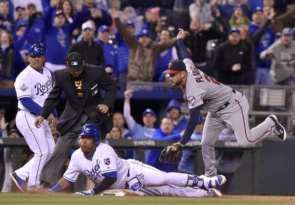 April 8, 2016 - Kansas City, MO, USA - The Kansas City Royals Salvador Perez slides into third with an RBI triple before the tag from Minnesota Twins third baseman Trevor Plouffe, right, in the eighth inning on Friday, April 8, 2016, at Kauffman Stadium in Kansas City, Mo. Minnesota at Kansas City - ZUMAm67_