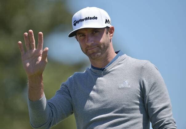 Dustin Johnson reacts to the fans applause on the first hole tee box in the third round of the 2016 Masters Tournament at Augusta National in Augusta, Georgia on April 9, 2016.  MAS20160409126 KEVINxDIETSCH