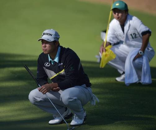 Hideki Matsuyama of Japan lines up a putt on the 10th green in the third round of the 2016 Masters Tournament at Augusta National in Augusta, Georgia on April 9, 2016.  MAS20160409148 KEVINxDIETSCH