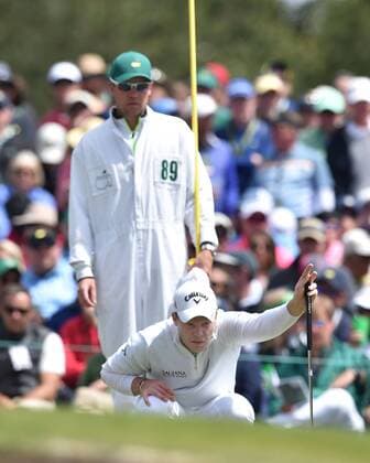 April 10, 2016 - Augusta, GA, USA - Danny Willett and his caddie Jonathan Smart line up a putt on the second green during the final round of the Masters on Sunday, April 10, 2016, at Augusta National Golf Club in Augusta, Ga. Masters final round - ZUMAm67_