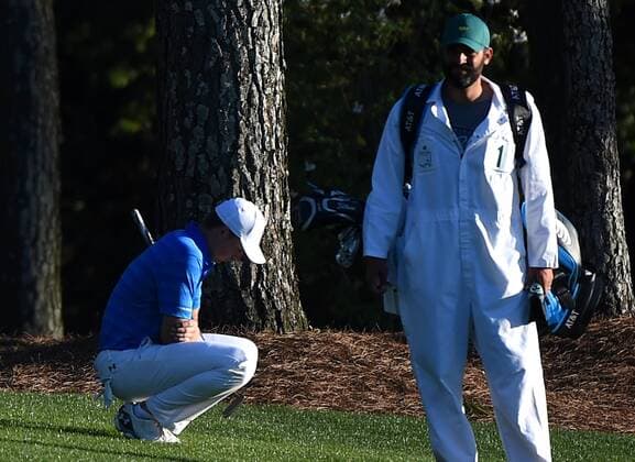 Caddie Michael Greller stands near Jordan Spieth who reacts in the 18th fairway in the final round of the 2016 Masters Tournament at Augusta National in Augusta, Georgia on April 10, 2016. Spieth lost control of the round after making a score of 7 on the par 3 12th hole knocking 2 balls into the water and failed to repeat as Masters champion. Danny Willett won in his second Masters and he became the first player from England to win the green jacket since Nick Faldo in 1996.  MAS20160410144 KEVINxDIETSCH