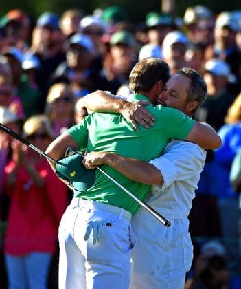 April 10, 2016 - Augusta, GA, USA - Danny Willett, left, is hugged by caddie Billy Foster after Willett sank his final putt on the 18th green during the final round of the Masters on Sunday, April 10, 2016, at Augusta National Golf Club in Augusta, Ga. Masters final round - ZUMAm67_