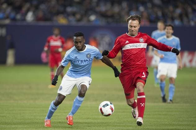 April 6, 2016 - Bronz, New York, U.S - New York City FC forward STIVEN MENDOZA (9) dribbles past Chicago Fire defender MICHAEL HARRINGTON Soccer 2016 - NYCFC vs Chicago Fire 0-0 - ZUMAs192