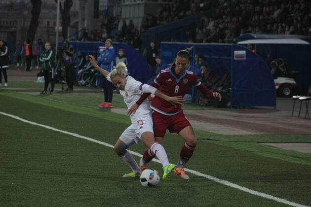 April 12, 2016 - St. Petersburg, Russia - Russian Federation. St. Petersburg. Qualification European Championship EM Europameisterschaft 2017 among women, Russia - Hungary, 3: 3. Qualification European Championship 2017 between the national women s teams of Russia and Hungary..Player of the Russian national football Daria Makarenko (8, in red) and the Hungarian national team Nationalteam player Jakabfi Jeanette Womens Soccer Qualification European Championship 2017  - ZUMAl75_