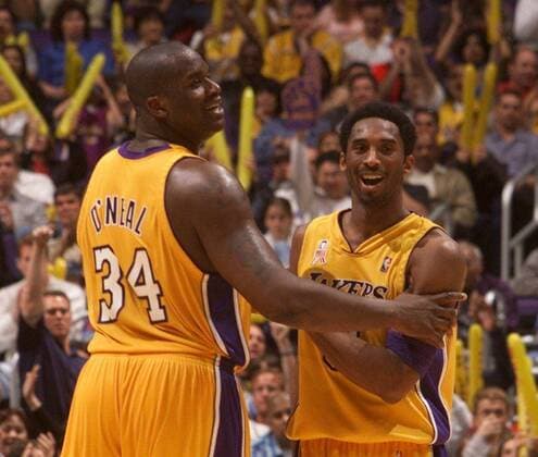 Kobe Bryant March 10, 2002 - U.S. - The Lakers Shaquille O Neal and Kobe Bryant share a laugh during the final minutes of the the Lakers 117-103 victory over the New York Knicks at the Staples Center in Los Angeles. Kobe Bryant Final Laker Home Game - ZUMAm67_